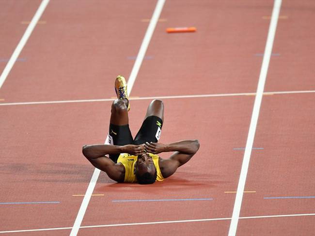Bolt se lamenta en la pista tras su lesión. Foto: Getty Images