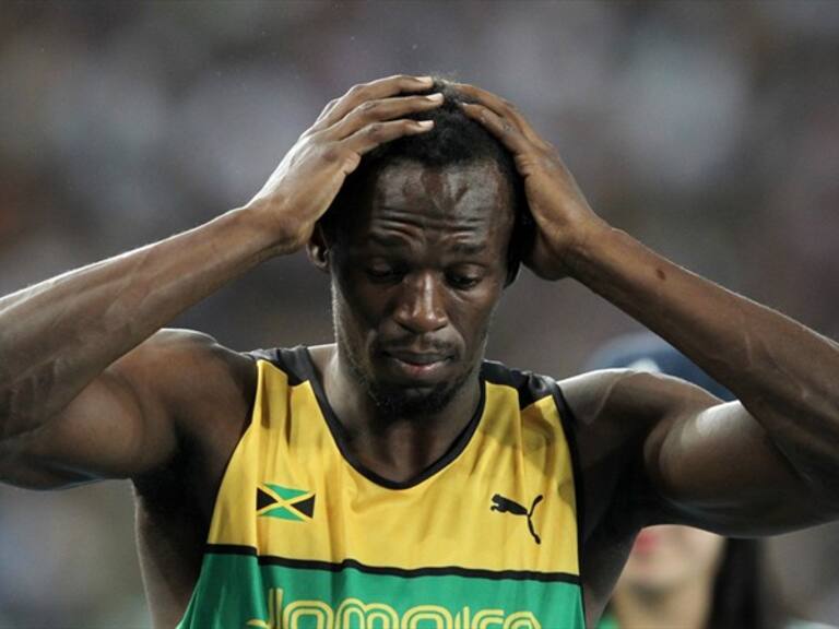 Usain Bolt se lamenta. Foto: Getty Images