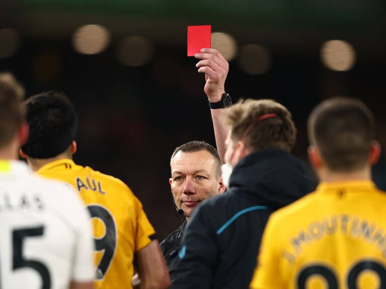 WOLVERHAMPTON, ENGLAND - MARCH 18: Raul Jimenez of Wolverhampton Wanderers is shown a red card for a challenge on Illan Meslier of Leeds United by referee Kevin Friend during the Premier League match between Wolverhampton Wanderers and Leeds United at Molineux on March 18, 2022 in Wolverhampton, United Kingdom. (Photo by Marc Atkins/Getty Images)